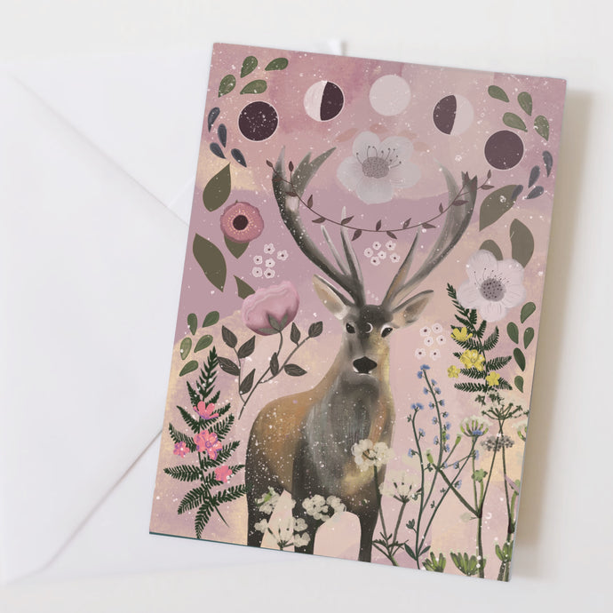 A pink card with a stag, flowers and the moon’s phases